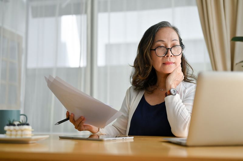 Professional reviewing case documents in a quiet office setting