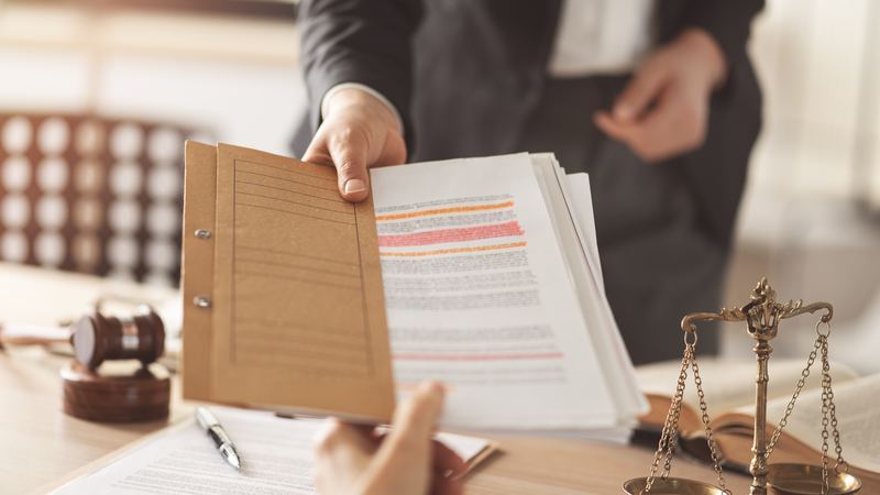 Papers and notes laid out on a professional's desk