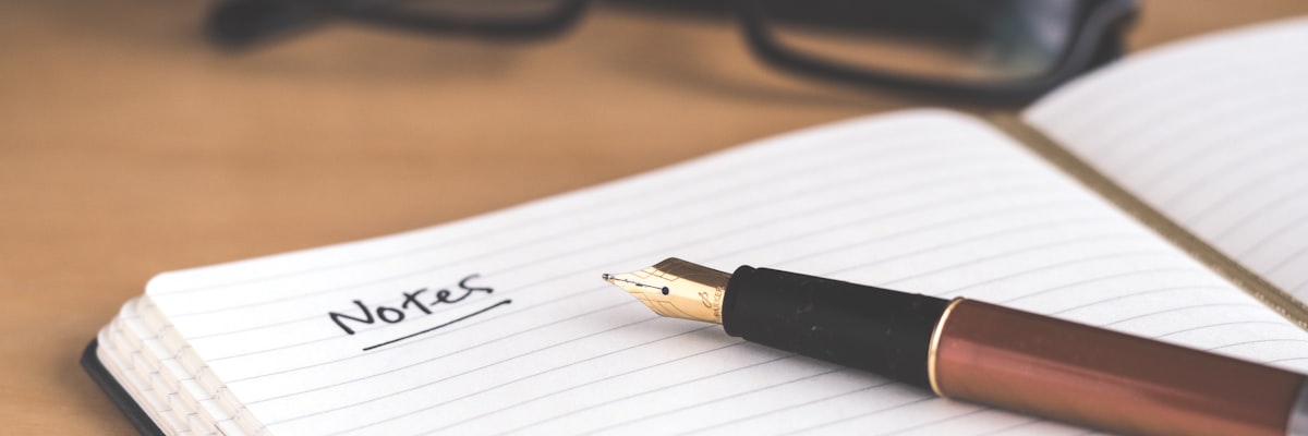Notebook and pen on a desk
